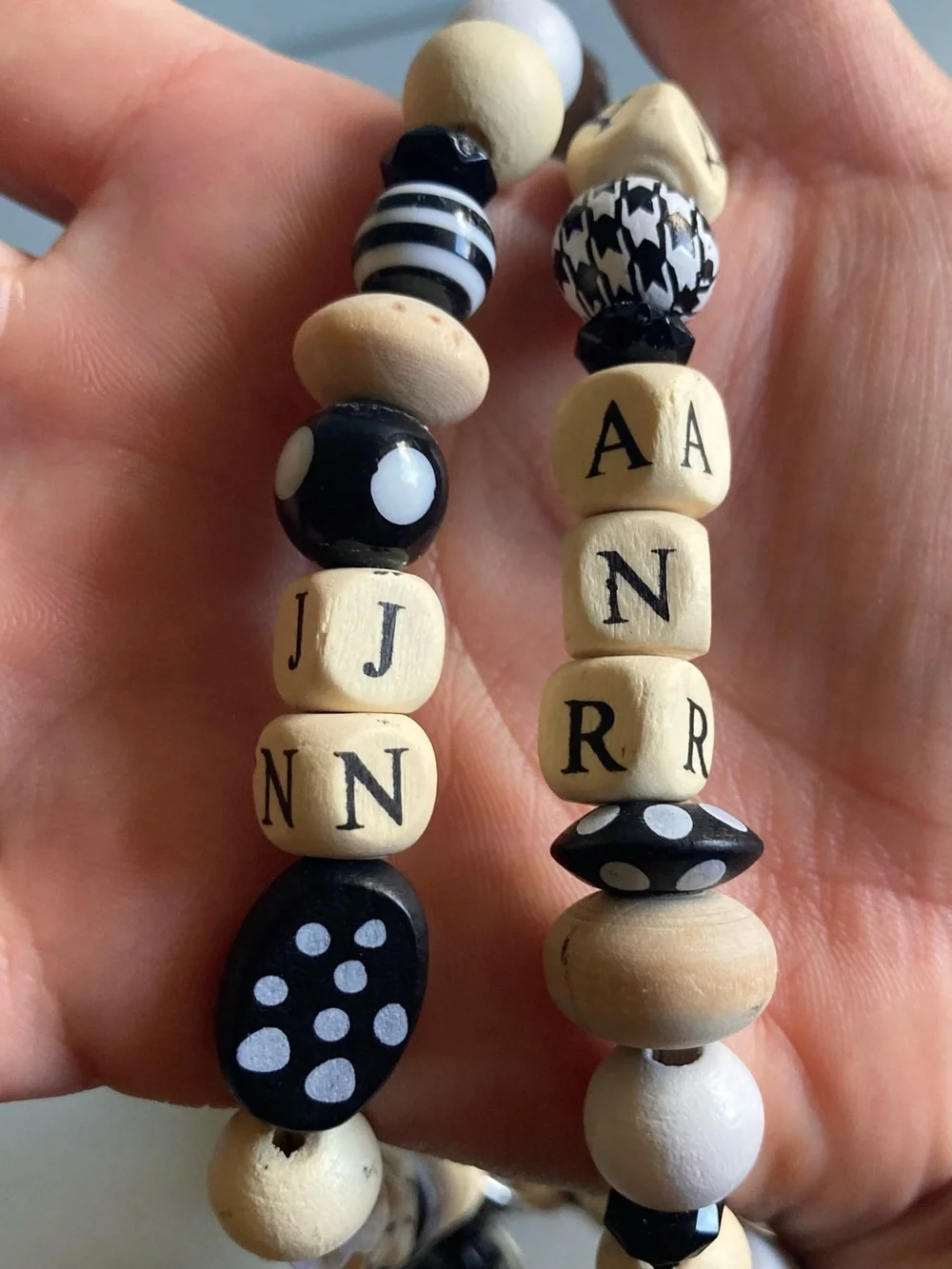 NWOT Plunder Black and Cream Beaded Pendant lanyard with Inspirational Charm